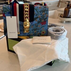NIB Gucci Blue Floral Leather Shoulder Bag with Gold Hardware and Striped Strap